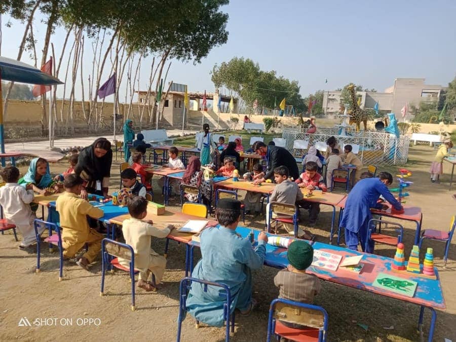 Children at an outdoor learning session at the community centre in Khairo Dero